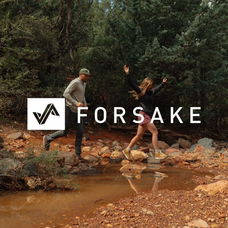 Image features a couple walking in the woods and a white Forsake logo.